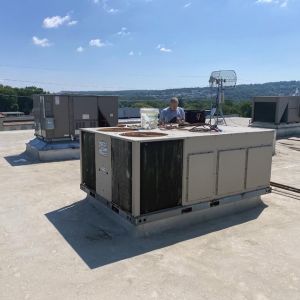 Servicing commercial rooftop HVAC system
